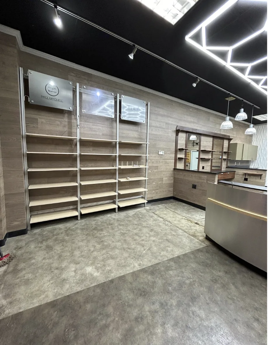 Retail display shelving and barber shop interior finishes completed by HQ Construction & Remodeling