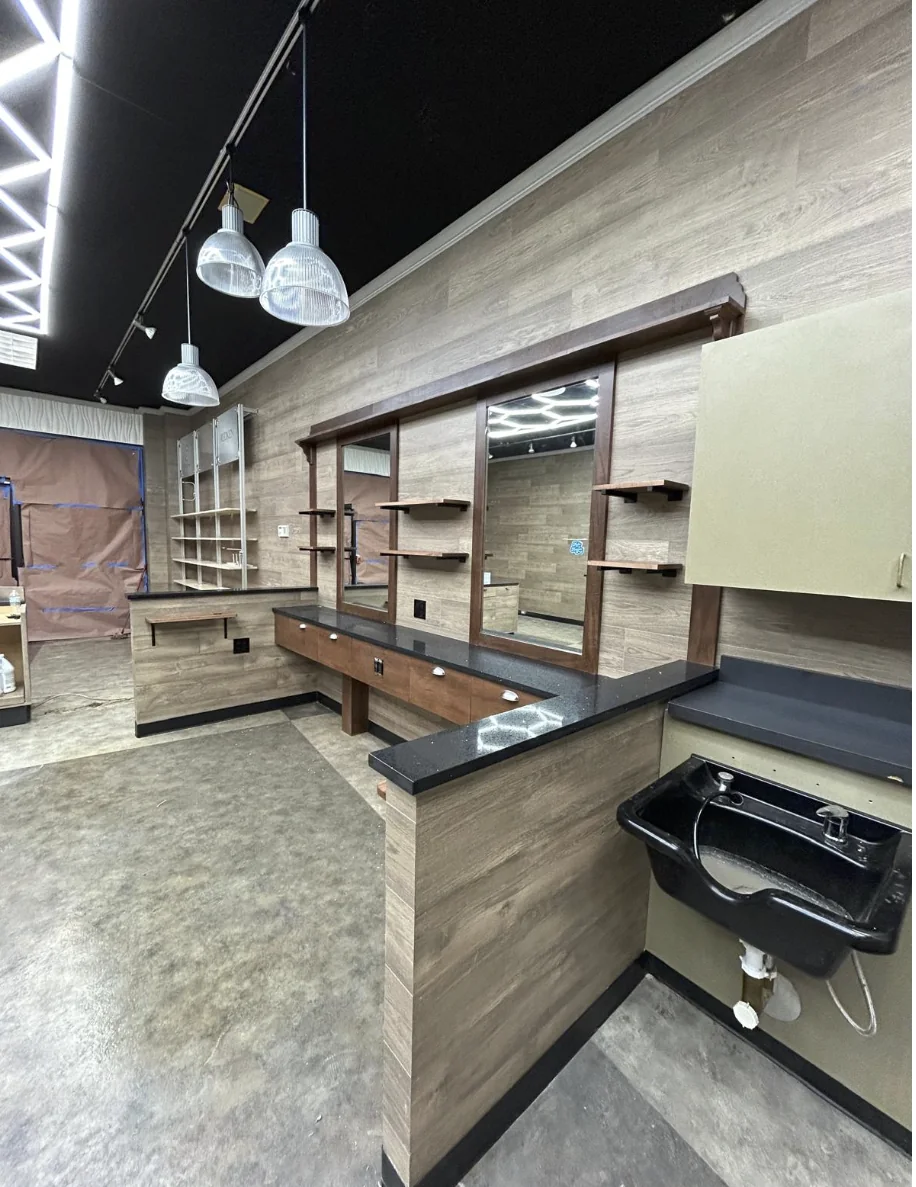 Barber shop wash station and custom cabinetry in completed commercial build-out
