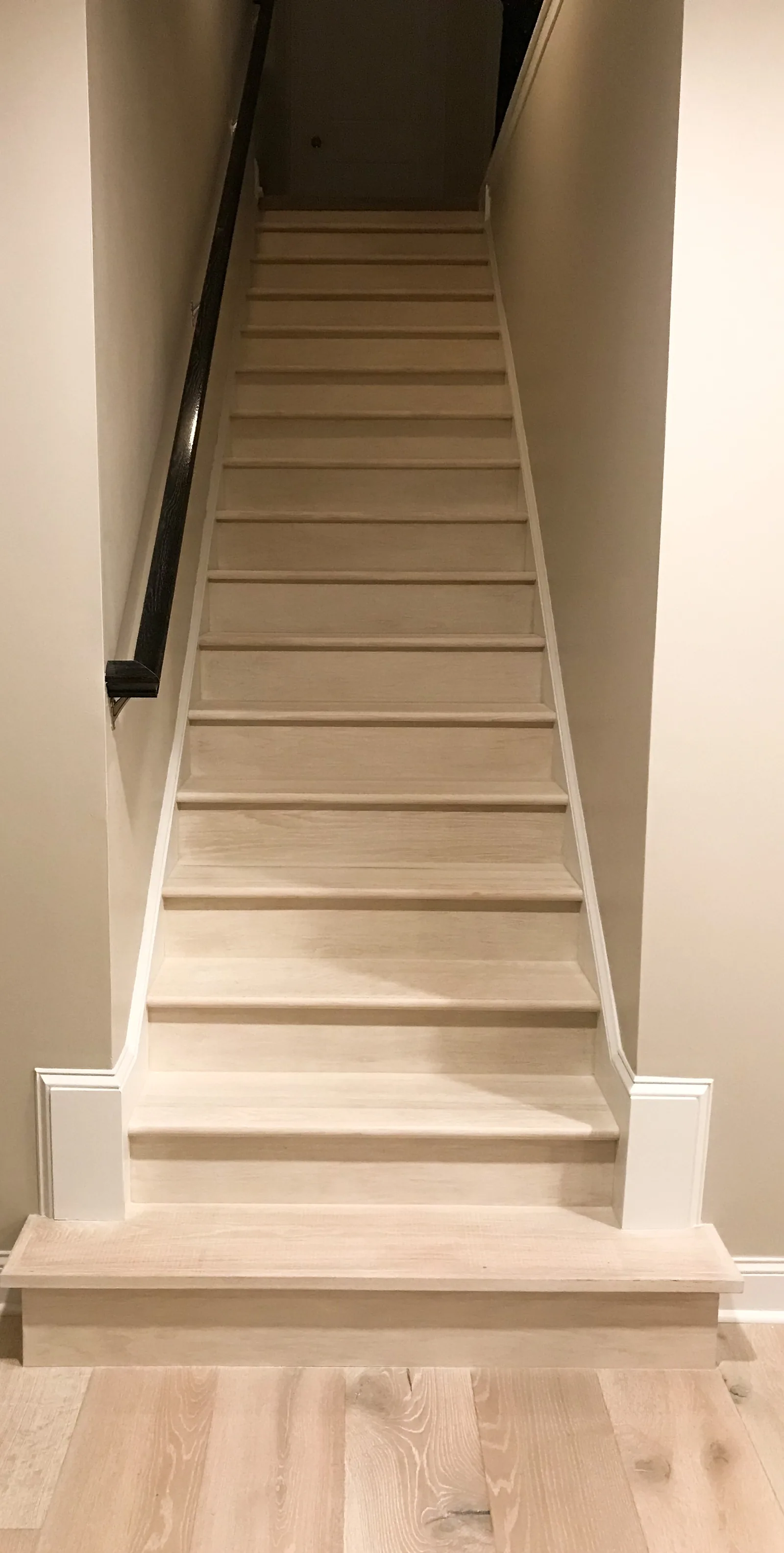 Interior remodeling project by HQ Construction & Remodeling featuring finished staircase and trim
