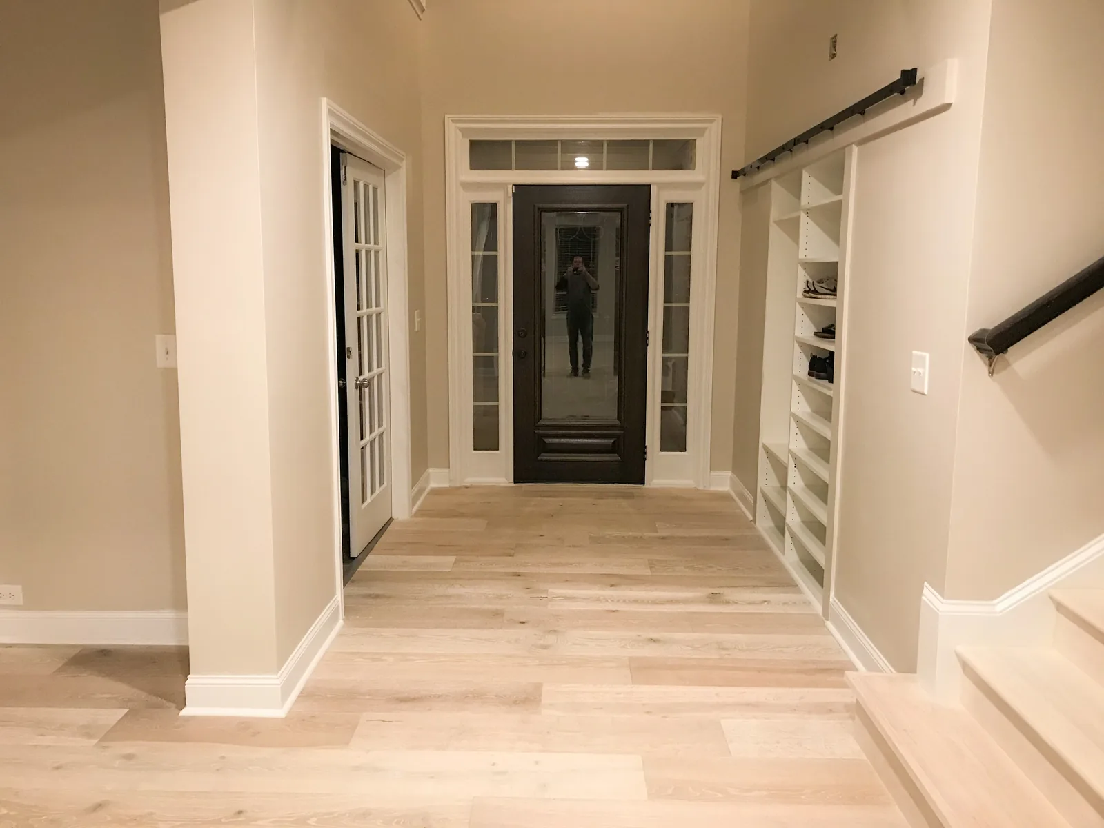 Interior renovation by HQ Construction & Remodeling with flooring, entry trim and built-in shelving